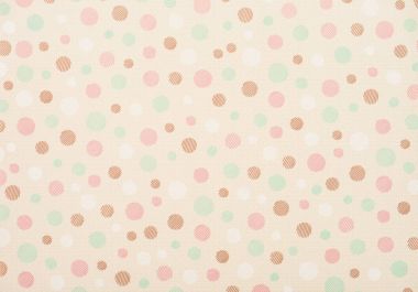 set of different sized colored circles on beige clipart