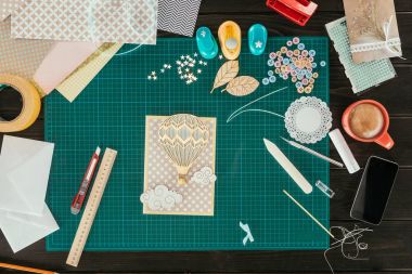 Top view of handmade scrapbooking postcard on a table clipart