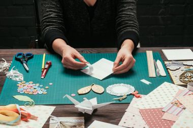 cropped image of woman making scrapbooking postcard clipart