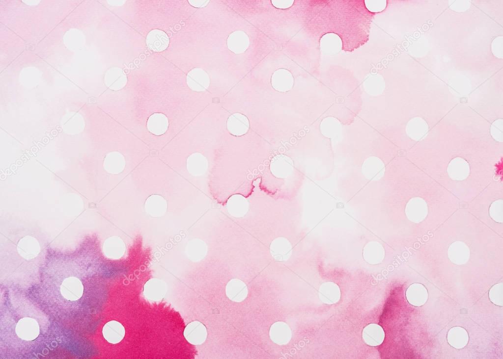 set of white circles on pink and burgundy watercolor surface