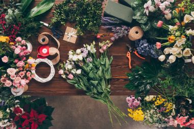 top view of bouquet of roses on florist table clipart