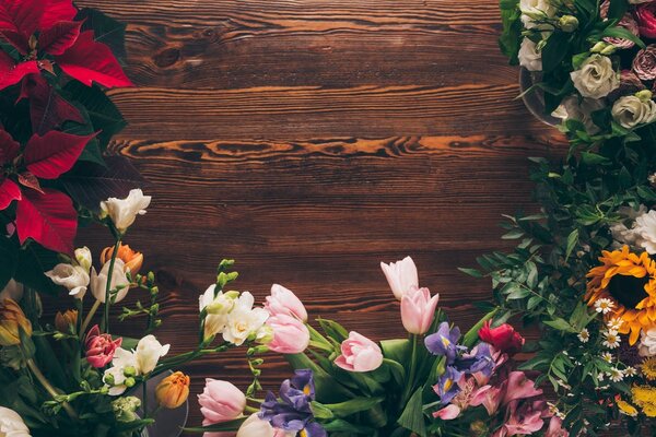 top view of colored flowers on table in flower shop