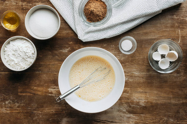 top view of preparation of ingredients for pastry on wooden table