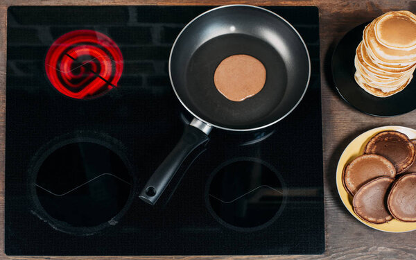 top view of pancake preparation on frying pan