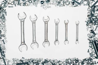 top view of metal wrenches, various bolts and framing nails isolated on white clipart