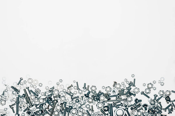 top view of arranged various metal engineering details with blank space isolated on white