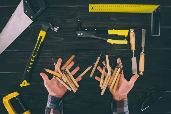 Partial View Carpenter Holding Chisels Various Industrial Tools Wooden Tabletop — Stock Photo, Image