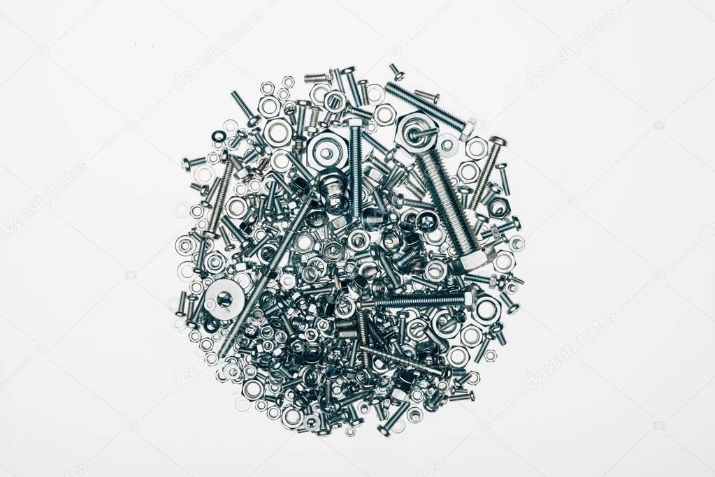 top view of various bolts and framing nails set isolated on white