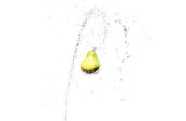 fresh ripe pear in water splashes isolated on white clipart