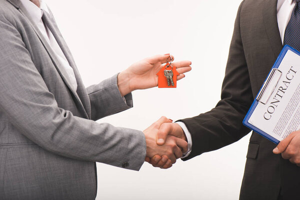 cropped image of costumer and estate agent shaking hands isolated on white