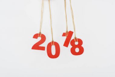 close up view of 2018 year sign hanging on strings isolated on white clipart