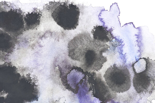Abstract painting with black and blue paint blots on white 