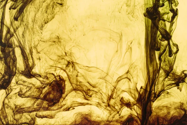full frame of yellow paint splashes and swirls