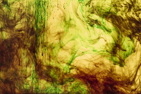 full frame of yellow and green paint splashes and swirls