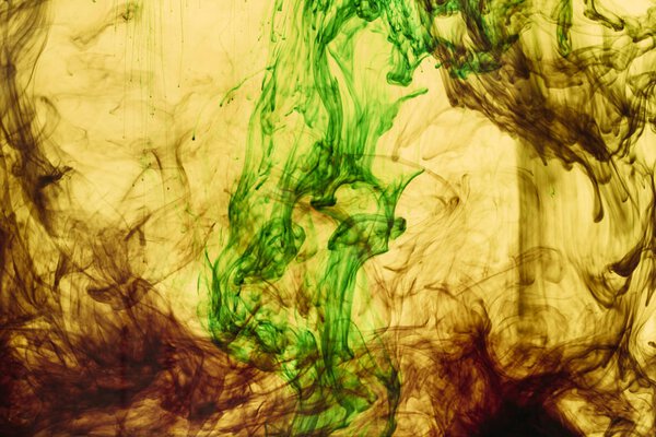 full frame of yellow and green paint splashes and swirls