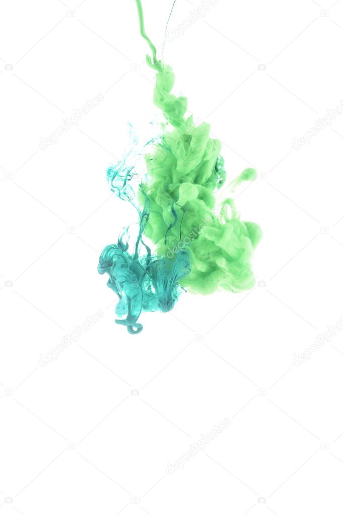 close up view of green and blue paint splashes isolated on white