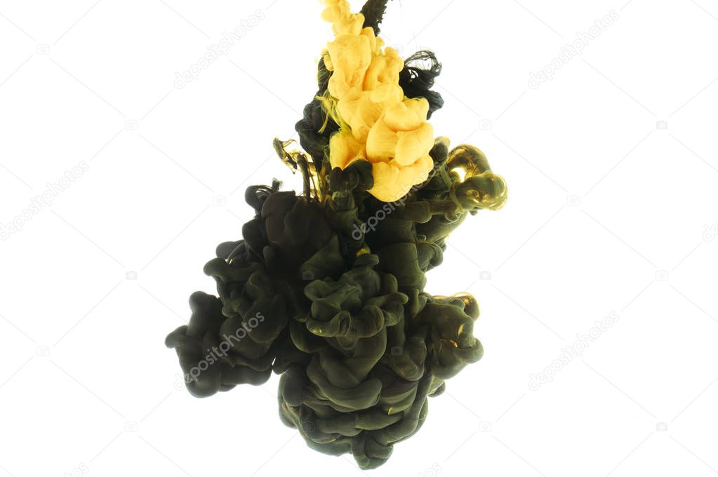 mixing of black and yellow paint splashes, isolated on white