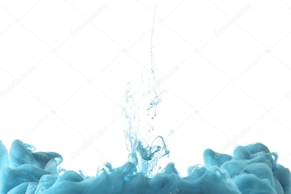 mixing of blue paint splashes isolated on white