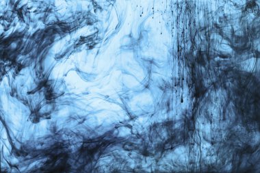 background with swirls of blue paint in water