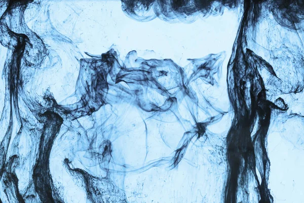background with swirls of blue paint in water