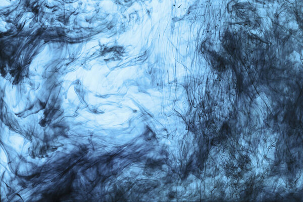 background with swirls of blue paint in water