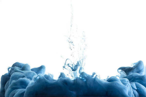 close up view of blue paint splash in water, isolated on white with copy space