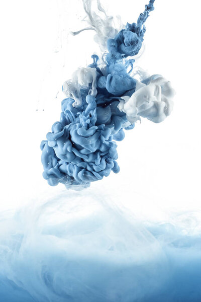 close up view of mixing of blue and white paint splashes isolated on white