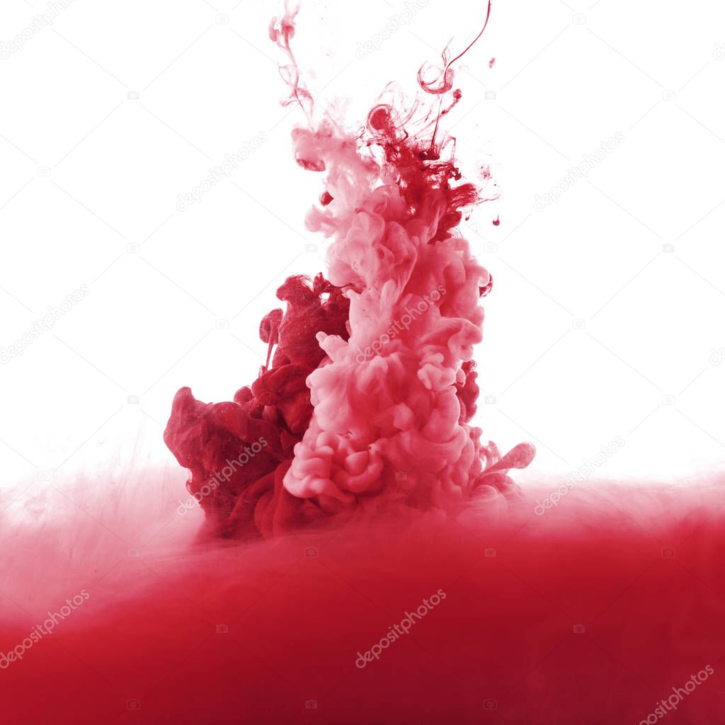 red paint splash in water, isolated on white