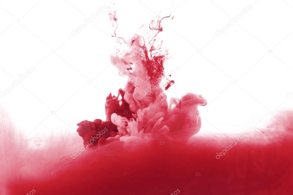 red paint splash in water, isolated on white