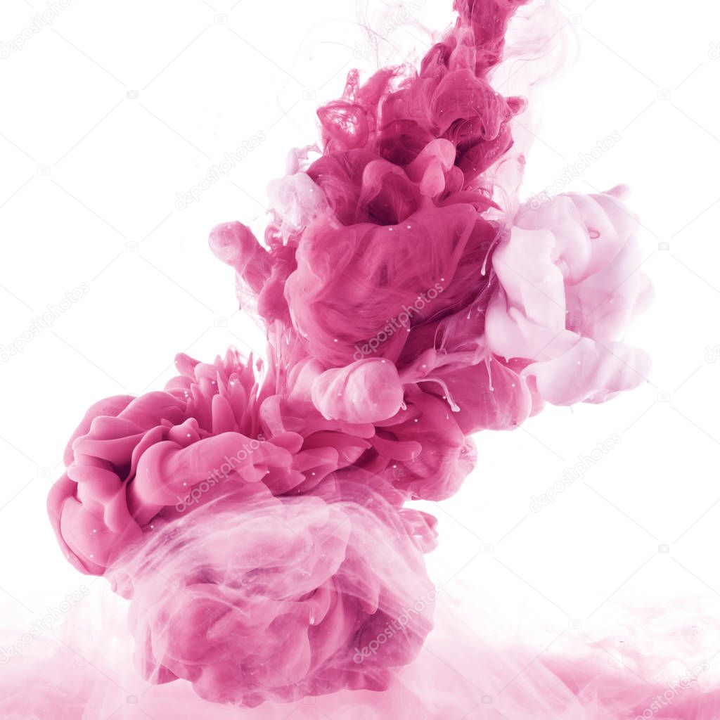 close up view of pink and light pink paint splashes in water, isolated on white