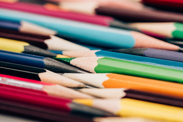 Close-up view of colorful pencils in mess as educational background