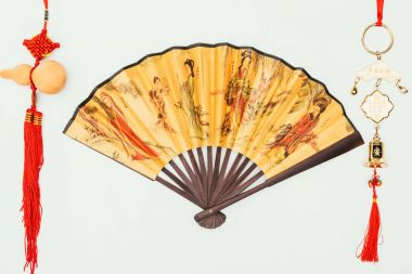 top view of chinese handheld fan with talismans isolated on white clipart