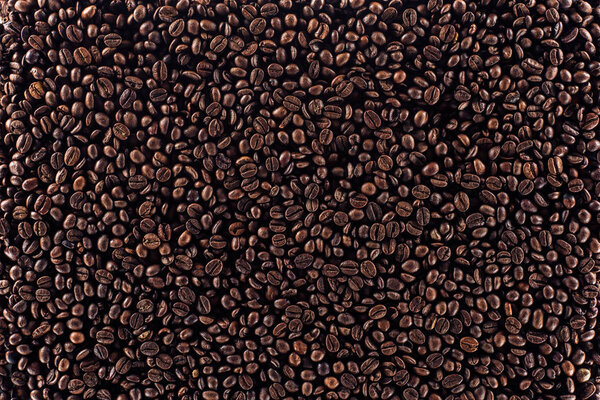 full frame of aromatic roasted coffee beans background