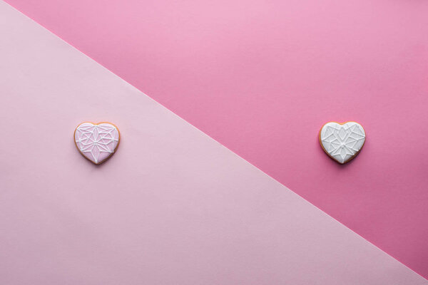 top view of sweet heart shaped cookies on pink, st valentines day concept
