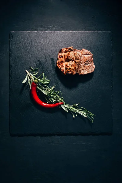 Top View Gourmet Grilled Steak Rosemary Chili Pepper Black Slate — Stock Photo, Image