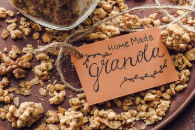 homemade crunchy granola with label on tray clipart