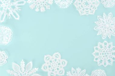 christmas frame with decorative snowflakes, isolated on light blue clipart