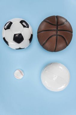 Balls for baseball, soccer, volleyball and basketball isolated on blue clipart