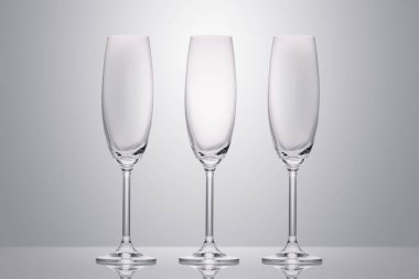 three empty clean glasses on white clipart