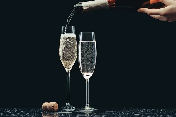 Cropped Image Woman Pouring Champagne Bottle Glasses Black — Stock Photo, Image