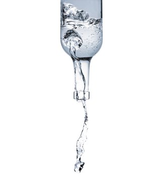 motion shot of water pouring from glass bottle isolated on white clipart