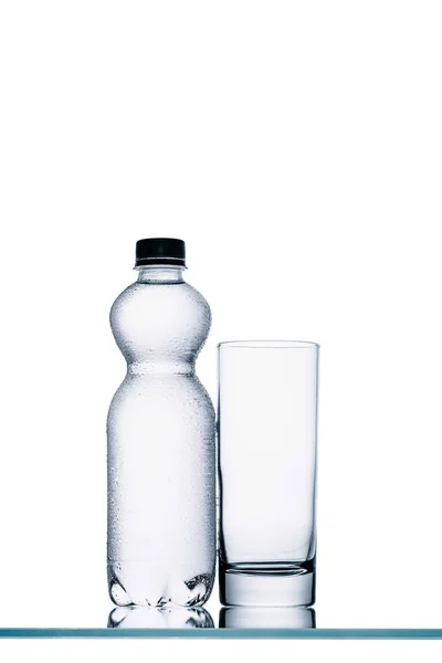 Full Plastic Bottle Water Empty Glass Isolated White — Stock Photo, Image