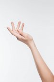 oříznuté záběr ženské ruky perfektní pleť izolované na bílém