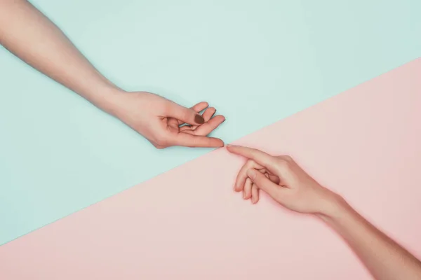 Cropped Shot Women Touching Fingers Halved Pink Turquoise Surface — Stock Photo, Image