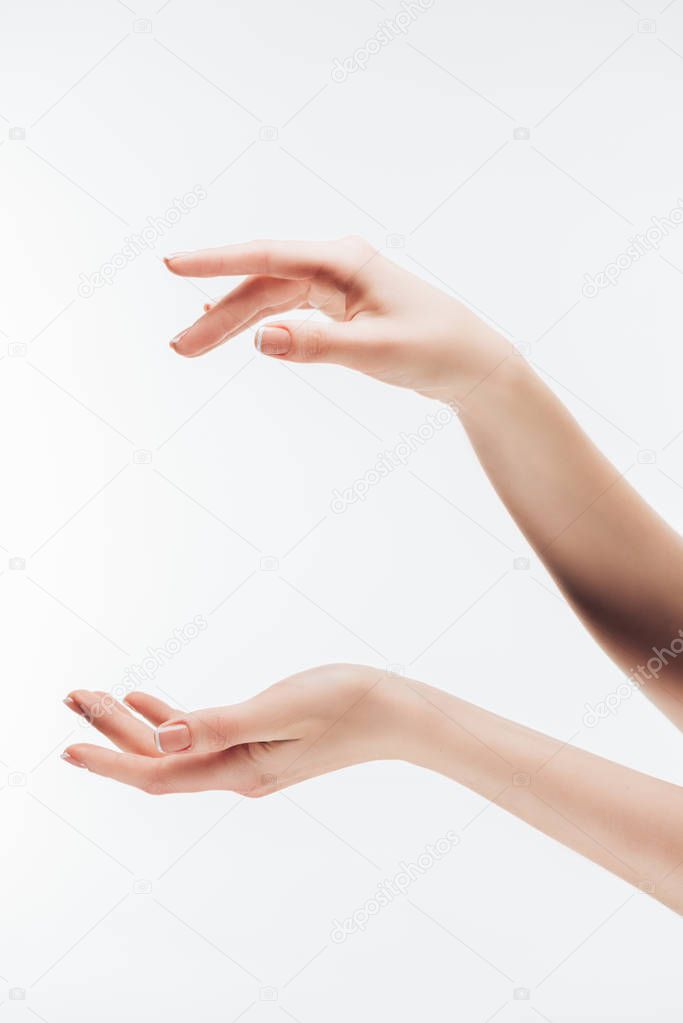 cropped shot of woman pretending holding something in hands with copy space isolated on white