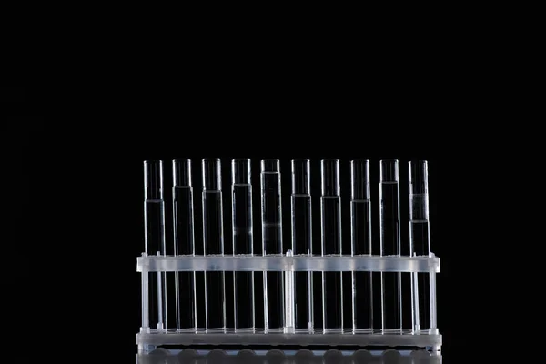 Row Glass Tubes Liquid Stand Isolated Black — Free Stock Photo