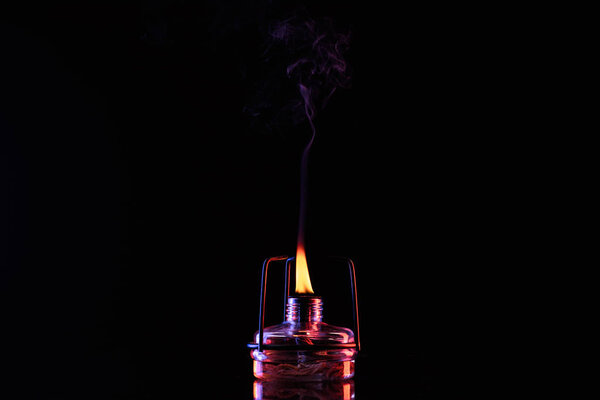 smoke from fire in chemical laboratory on black