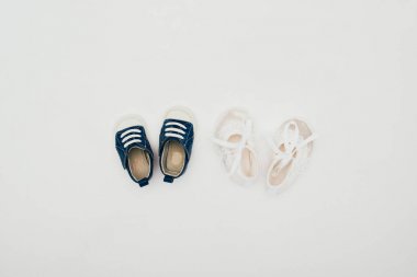top view of two pairs of baby shoes isolated on white clipart