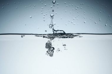 minimalistic background with water splash and bubbles, isolated on white