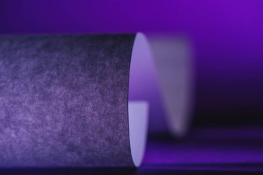 close up view of grey paper on purple surface